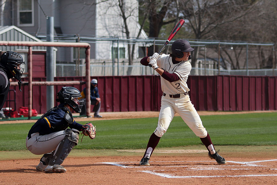 Baseball co-captain Drew Schmidt brings back his bat before swinging at the ball in a home game earlier this season.