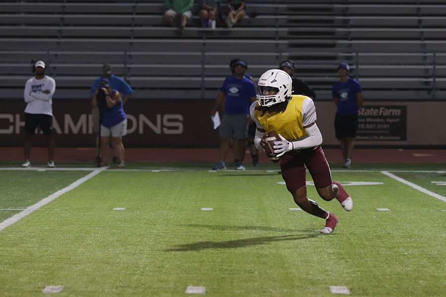 Senior quarterback Zephen Walker looks down the field for a receiver during the scrimmage against Byron Nelson on Thursday, Aug. 17.