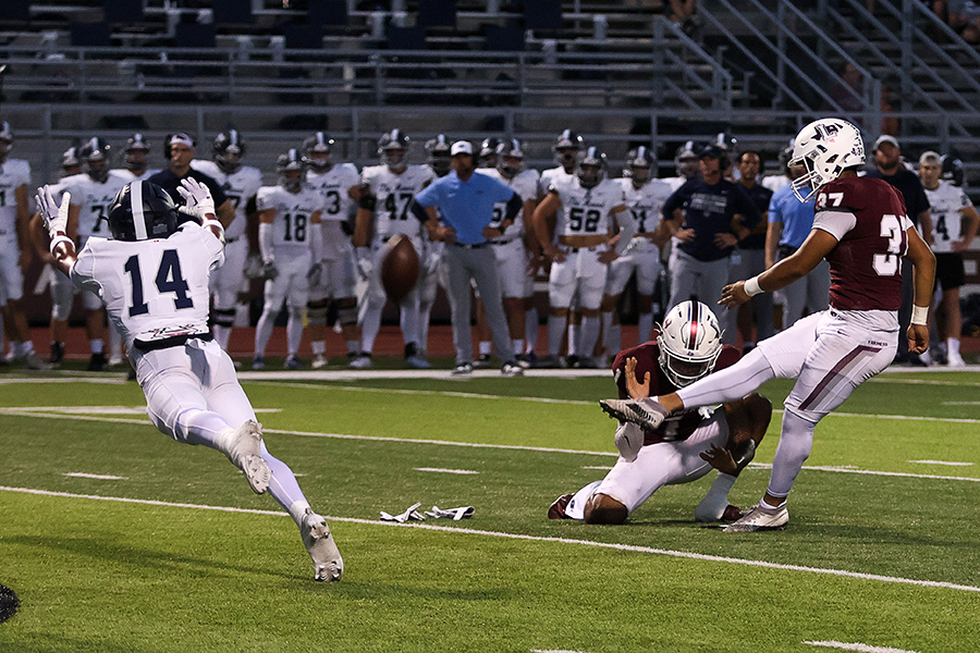 Kicker Eric Arias (37) kicks an extra point in the third quarter of the Flower Mound game. It was the teams first game against a district opponent this season.