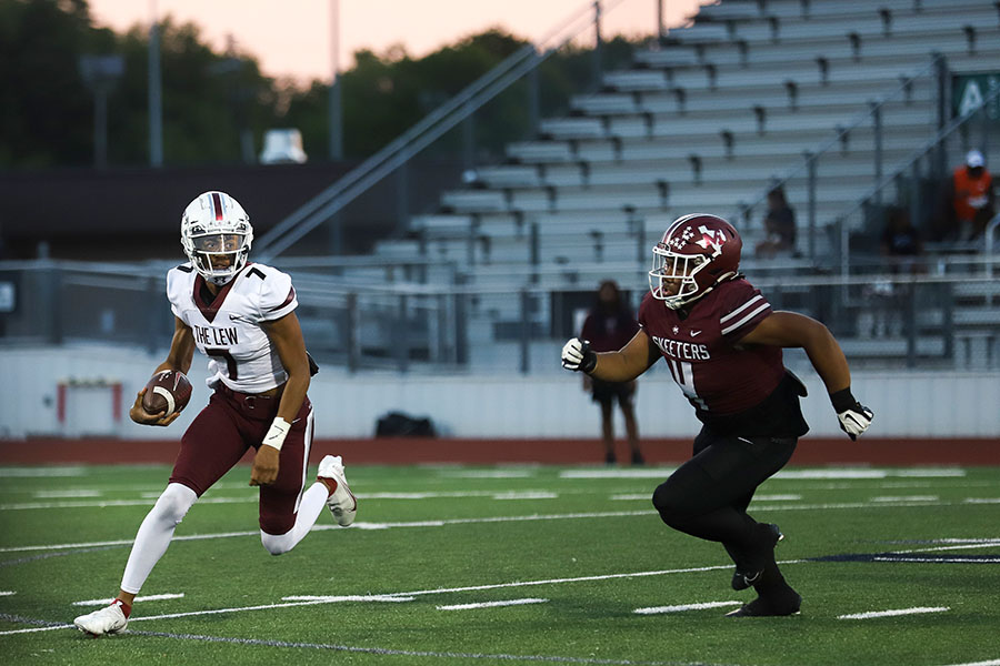 Senior quarterback Ethan Terrell (7) looks for first down yardage after dodging a Mesquite defender Dominic Betts (4) in the first quarter of the away game against Mesquite. 