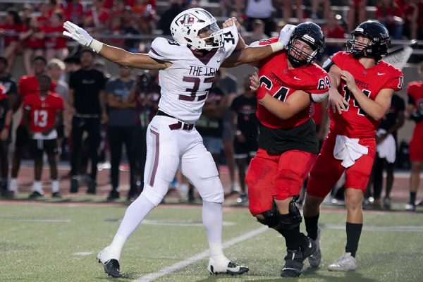 Defensive end Sean Oliver rushes the quarterback against Coppell offensive lineman David Baker. 