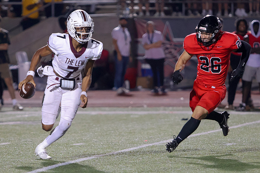 Quarterback Ethan Terrell runs with the ball before a pass in the fourth quarter of the Coppell football game.  