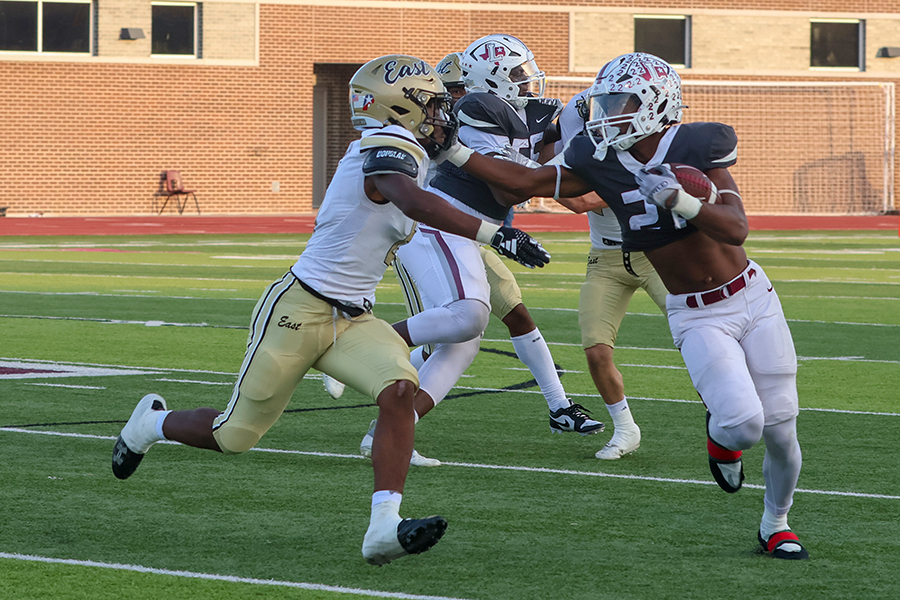 Running back Viron Ellison (21) stiff arms Panthers linebacker Excel Oleru (6) as Ellison gains a first down. 