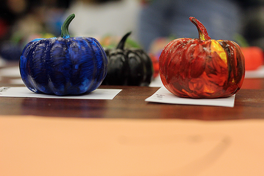 Painted pumpkins sit on the table to dry at the National Honor Society booth.
