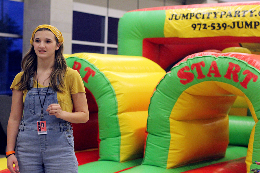 Senior Emmerson Webster works for Student Councils bounce house booth. 
