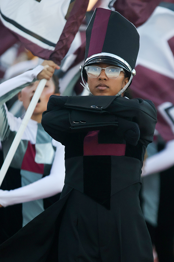 Senior drum major Kiaraliz Molina Cruz marches down the track, leading the marching band to the fight song before the homecoming football game on Friday, Oct. 13. 