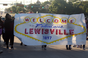 Students lead the 2022 homecoming parade down Main Street.