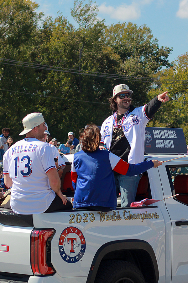 Catcher Austin Hedges points out into the crowd at the Texas Rangers World Series championship parade on Friday, Nov. 3.