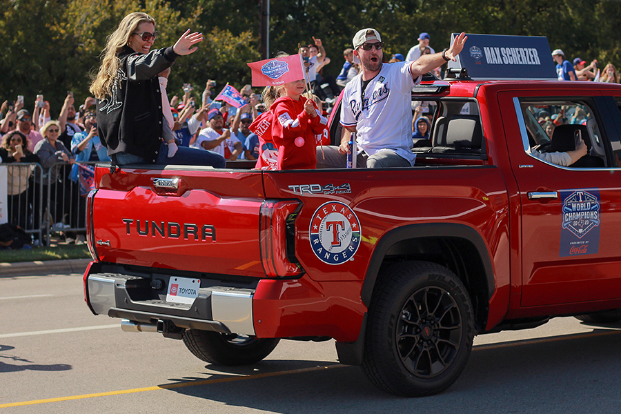 Pitcher Max Scherzer and his family wave toward the crowd during the Texas Rangers World Series championship parade on Friday, Nov. 3.