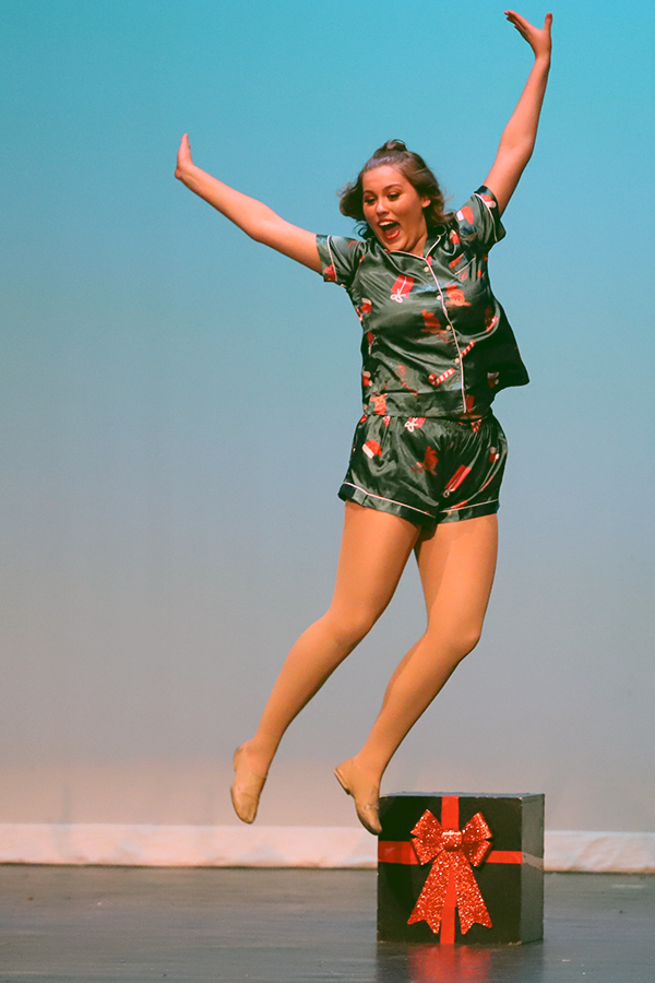 Senior lieutenant Bella Ortega jumps in the air as she performs a jazz routine to Polar Express.