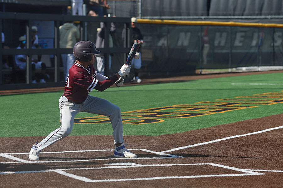 Junior Andres Olivares bunts the ball in a game against Plano East on Friday, March 15. The Farmers finished with one hit in the loss, compared to the Panthers six.