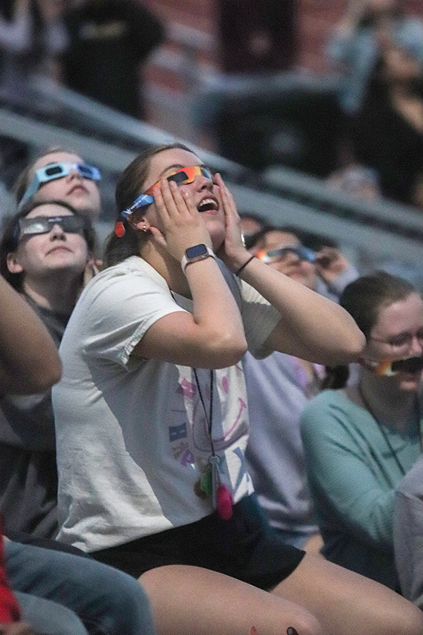 Senior Bella Ortega watches in awe at the sight of the total eclipse near full totality on Monday, April 8.
