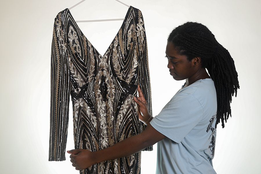 Junior Precious Cornelius keeps the dress hung up in her closet. As prom night approaches, she counts down the days.