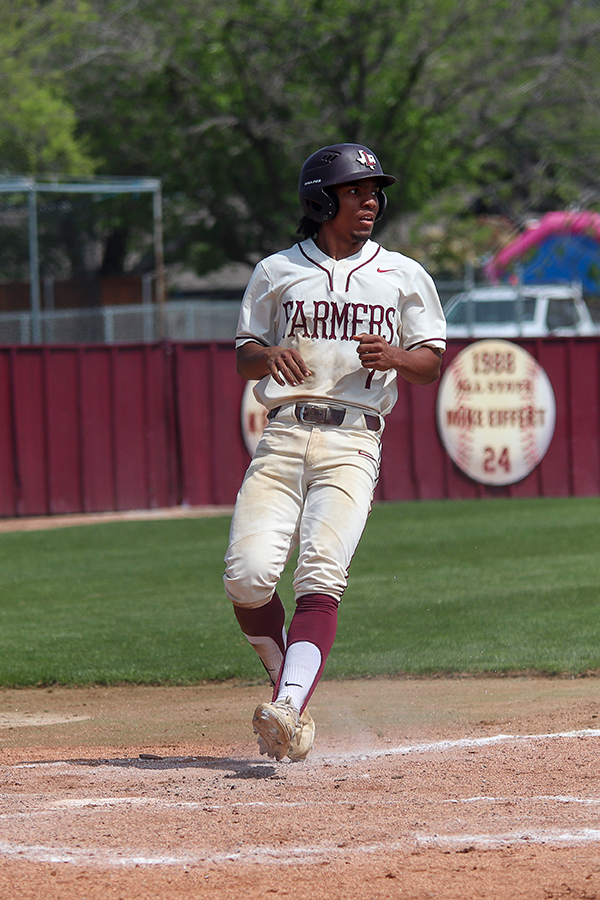 Sophomore left fielder Donovan Smith rounds the bases for a score against Denton Ryan on Saturday, March 16. 