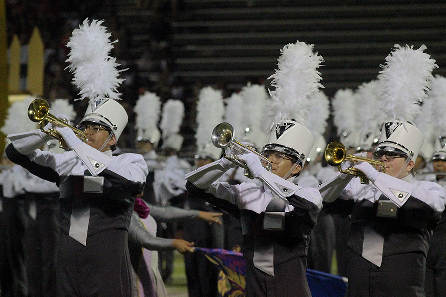 Junior Gabriel Raz, sophomore Cesar Del Angel Ramirez and sophomore Kellen Graig begin the band performance after the win against Braswell. 