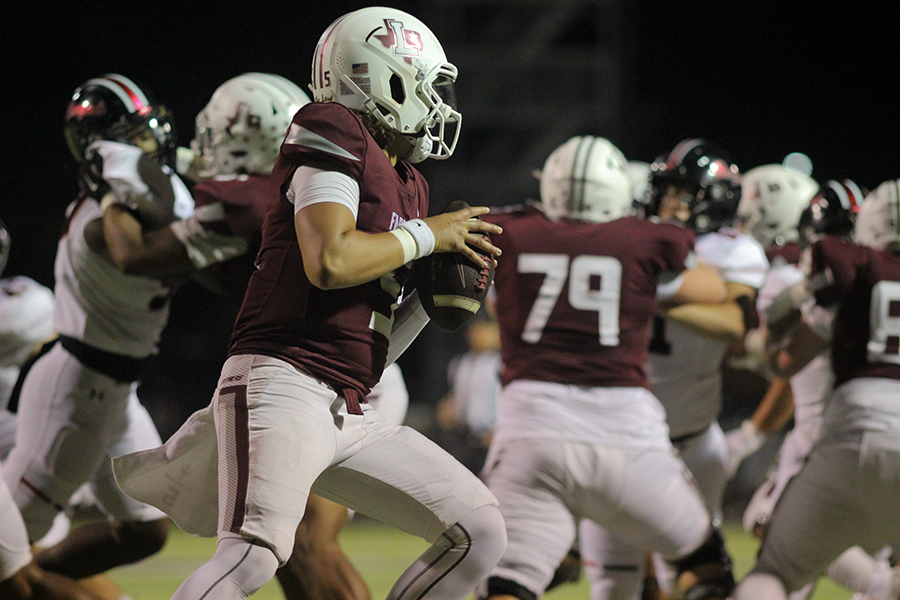 Sophomore Tre Williams prepares to pass the ball to a receiver. 