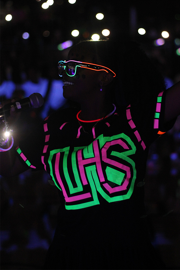 Senior Reaunna Fletcher hypes the crowd at the blackout pep rally.