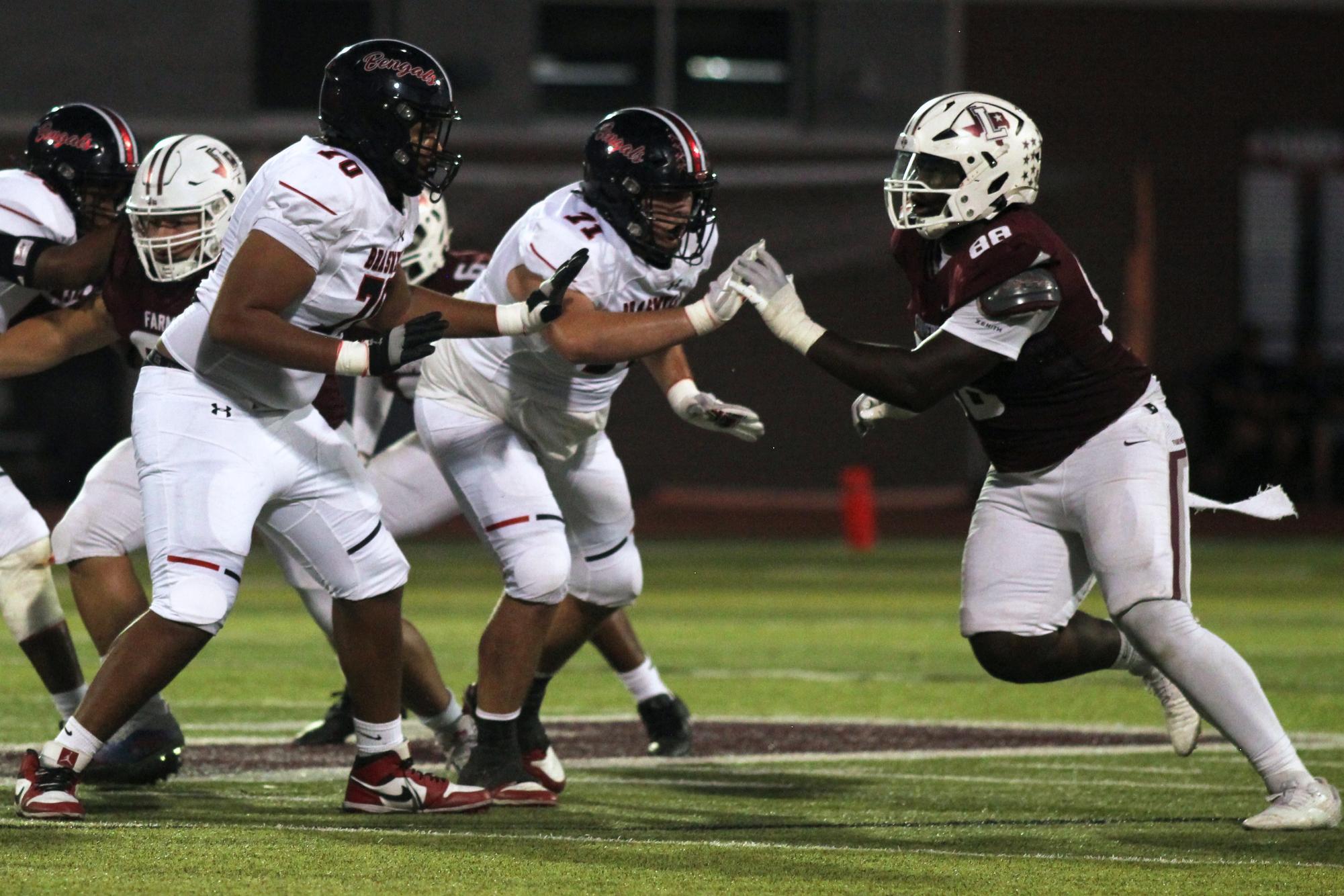 Junior tight end Xavier Fleming blocks the opposing Braswell defenders during the homecoming game on Friday, Oct. 4.