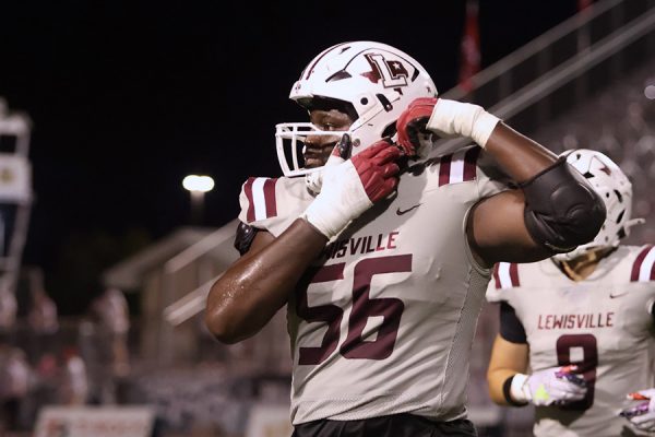 Senior Michael Fasusi adjusts his helmet during the BOTA game on Friday, Sept. 27.