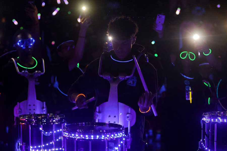 With the crowd behind him, senior Ben Lennard plays the snare drum.