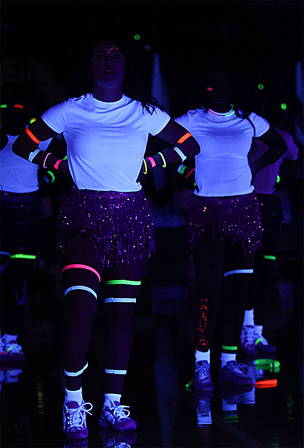 Cheerleaders prepare to perform at the pep rally.