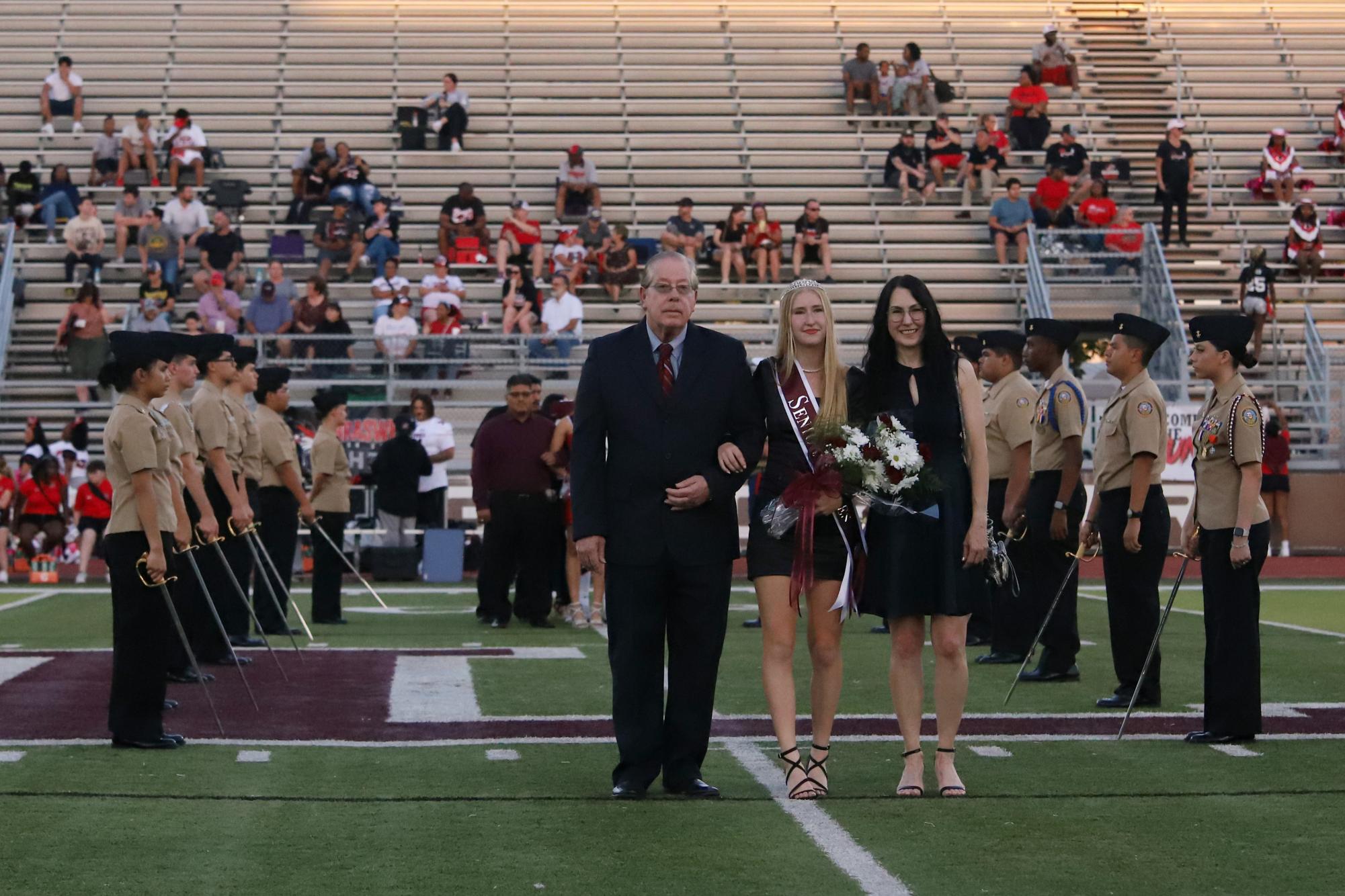 Senior Luca Bella Francis is announced as homecoming royalty alongside her family.