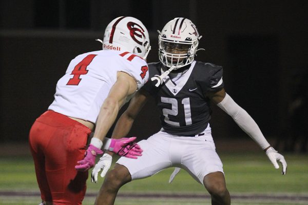 Junior cornerback Kanye Anderson blocks Coppell senior Scott Fishpaw while the Farmers receive a punt.