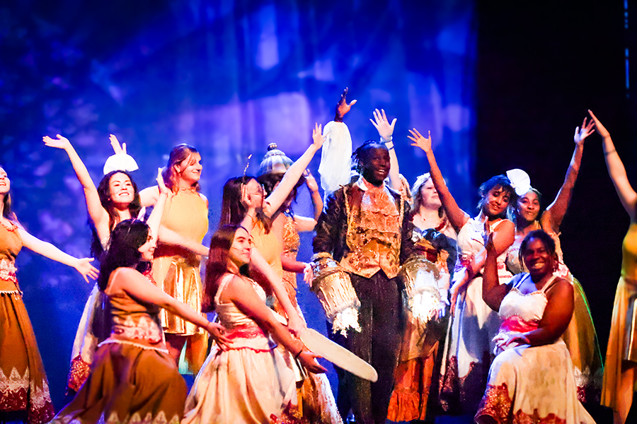 Cast members perform the hit musical number, 'Be Our Guest.'