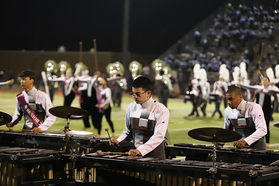 Percussion perform during half time at the football game.