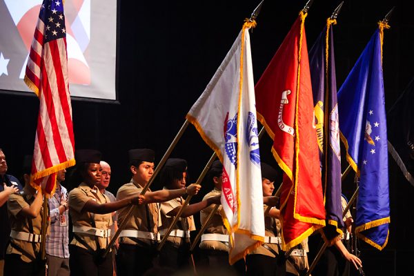 ROTC cadets lower their flags to commence the ceremony. 