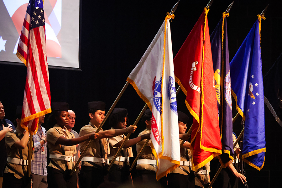 ROTC cadets lower their flags to commence the ceremony. 