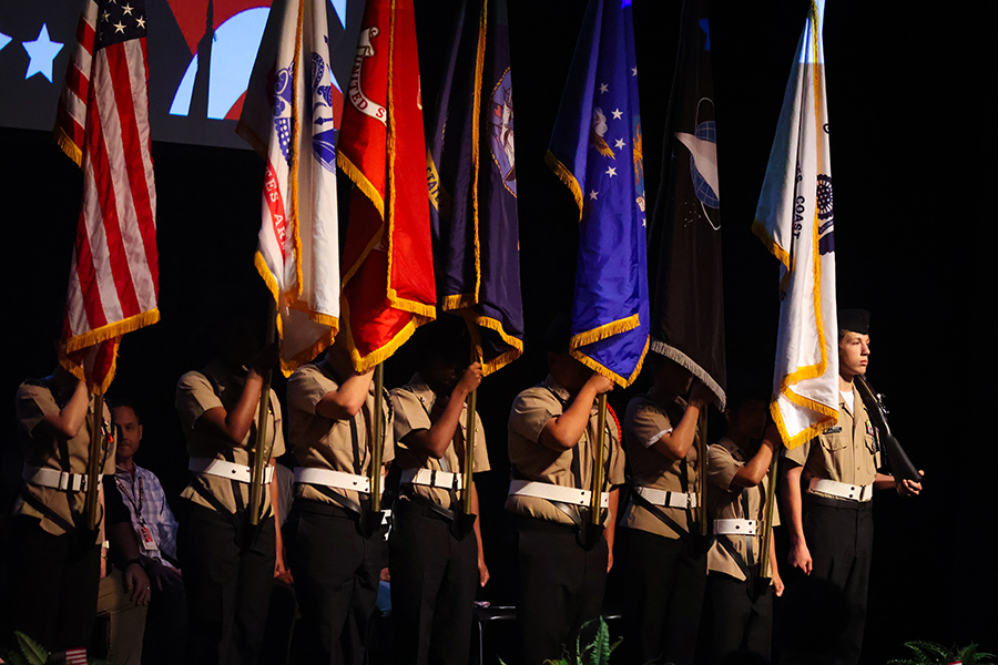 ROTC cadets raise their flags to end the opening ceremony. 