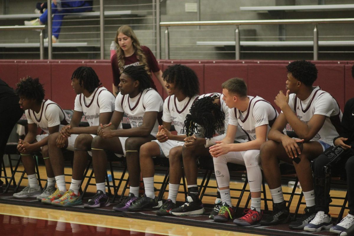 The Farmers sit on the bench during their game vs Plano East