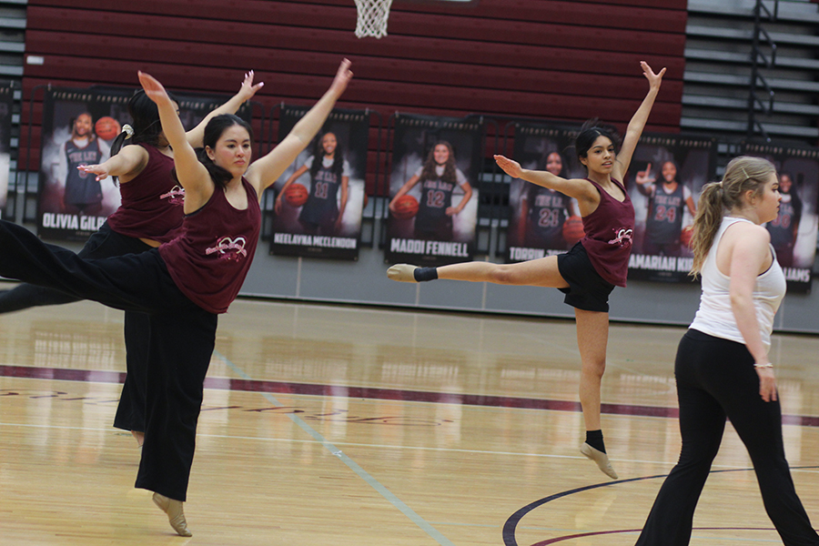 Junior Ariana Resendez, junior Rosie Espino and senior Caroline Coyle practice leaps. 