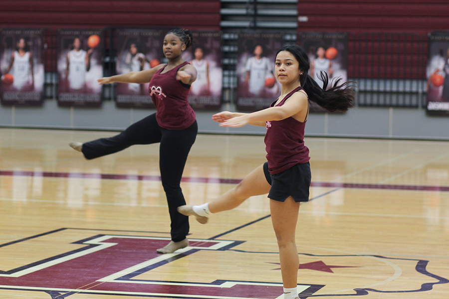 Senior Nailah Morgan and junior Mia Rangel practice pirouettes.