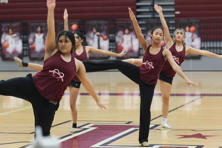 Senior Jessica Martinez, junior Carys Williams, sophomore Alina Charone and junior Rosie Espino in the middle of elite contemporary.