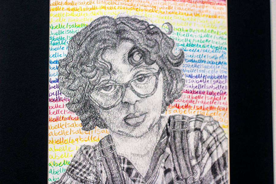 Junior Isabelle Gourley's mixed media signature self portrait is a new venture for the artist. "I've never done anything like that," Gourley said. "You can make artwork that's interesting and you don't need to just draw it, you can use letters to make art – and anything is possible [with art]." 