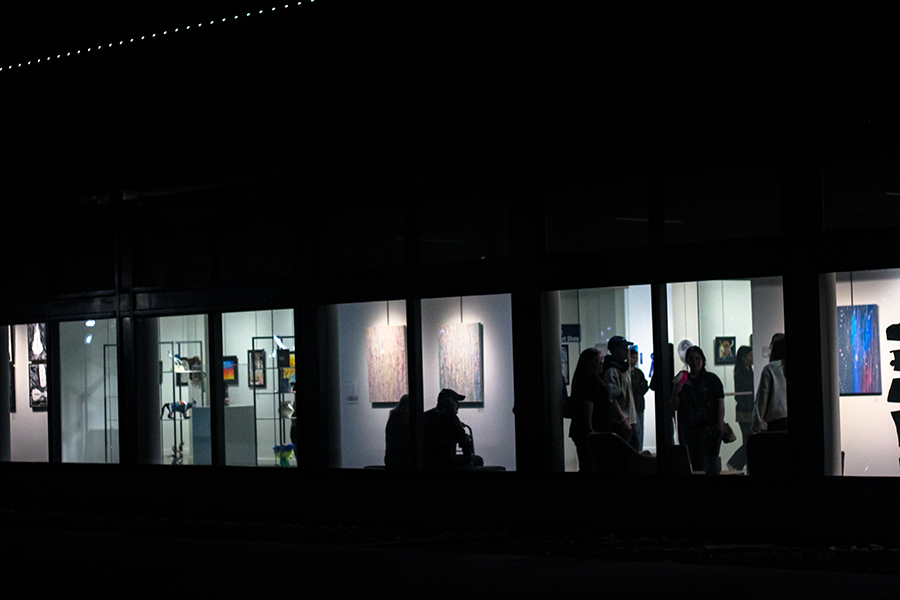 Audiences gather in the Grand Theater to look at the art gallery. 