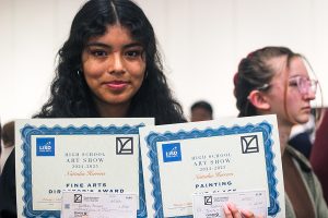 Senior Nattalia Herrera shows the awards she earned for the pieces she created.