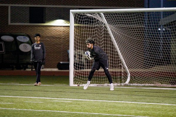 Goalkeeper Sebastian Guerrero warms up before the game against Denton Guyer.