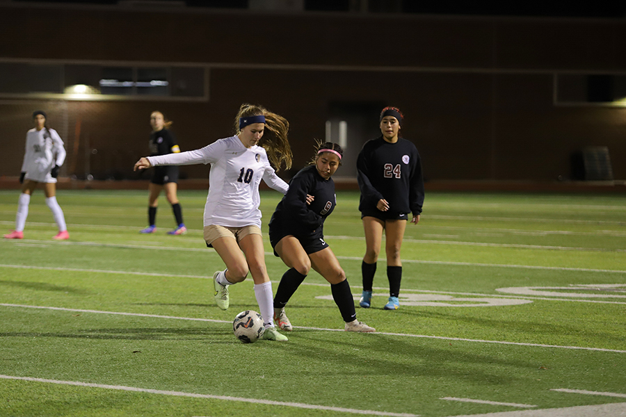 Senior Sofia Flores (9) defends against Little Elm.