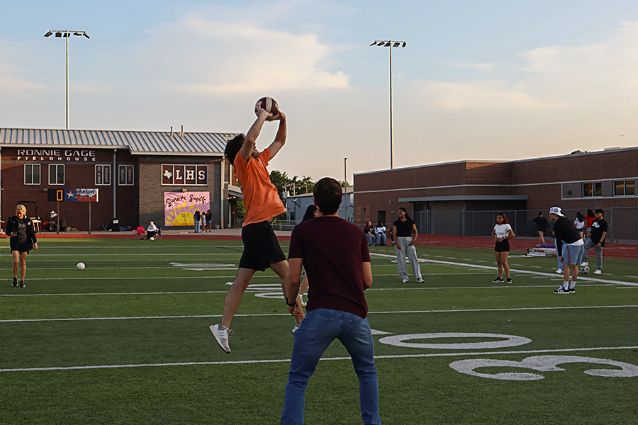 Senior Foster McNeal sets the ball mid air.