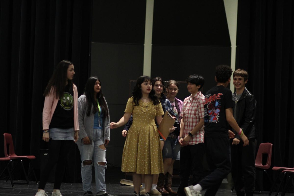 All Students circle around Miss Nelson.
