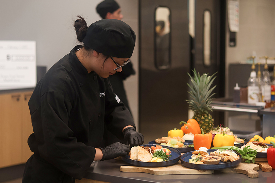Advanced student Amelia Luong plates the breakfast demo. 