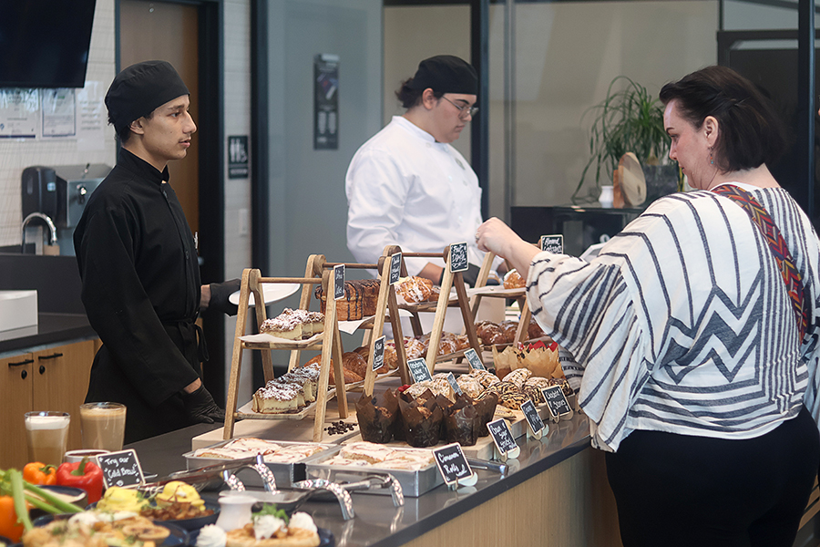 Advanced student Andres Trejo serves a customer. 