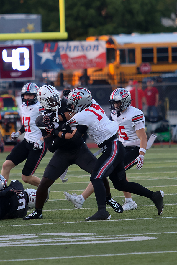 Junior Landon Bogany attempts to break through Marcus defense. 