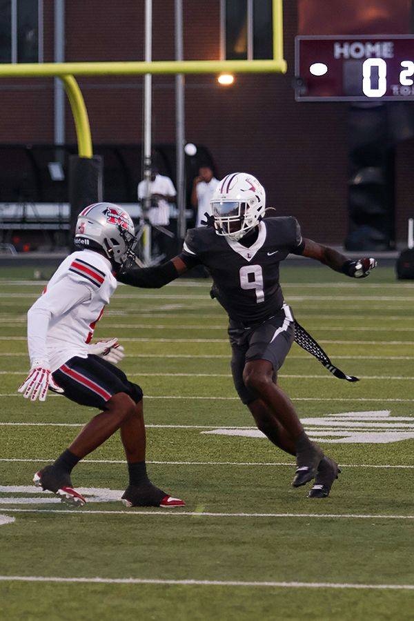 Senior Dylan Davis runs a route on fourth down during the first quarter.  