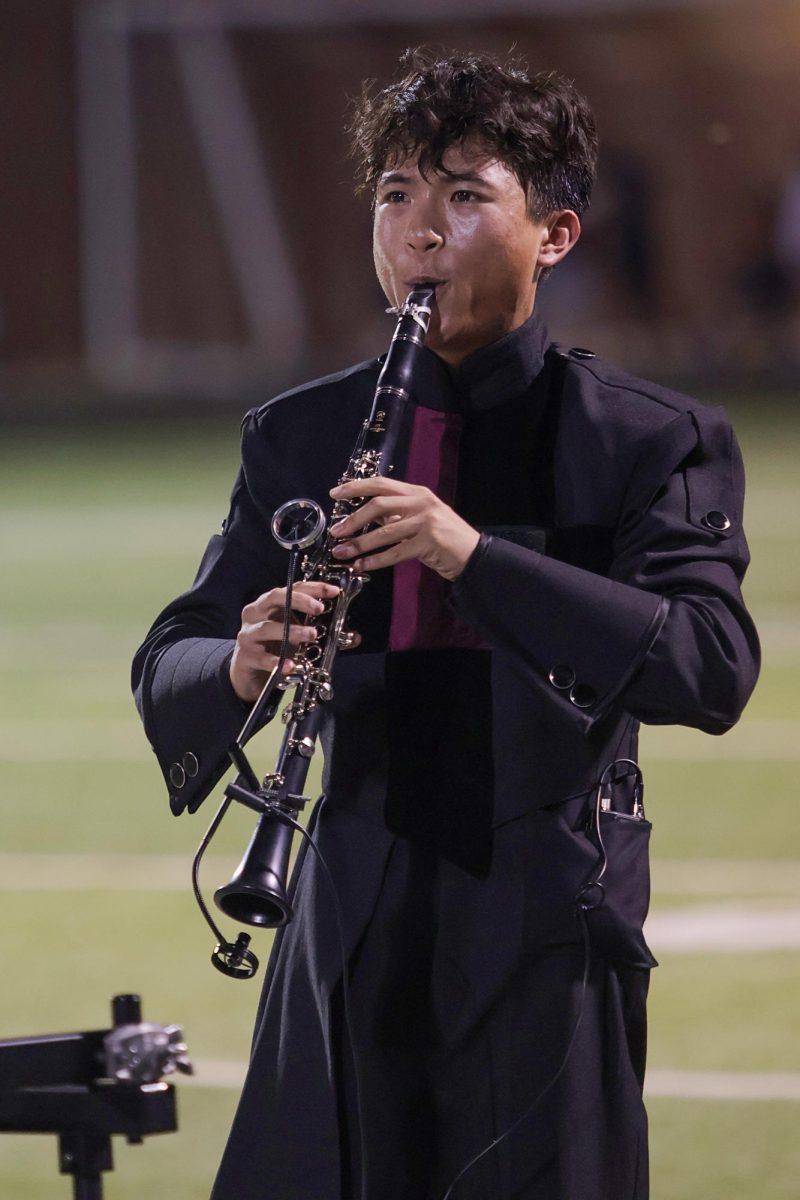 Drum Major Tien Tran performs during halftime.