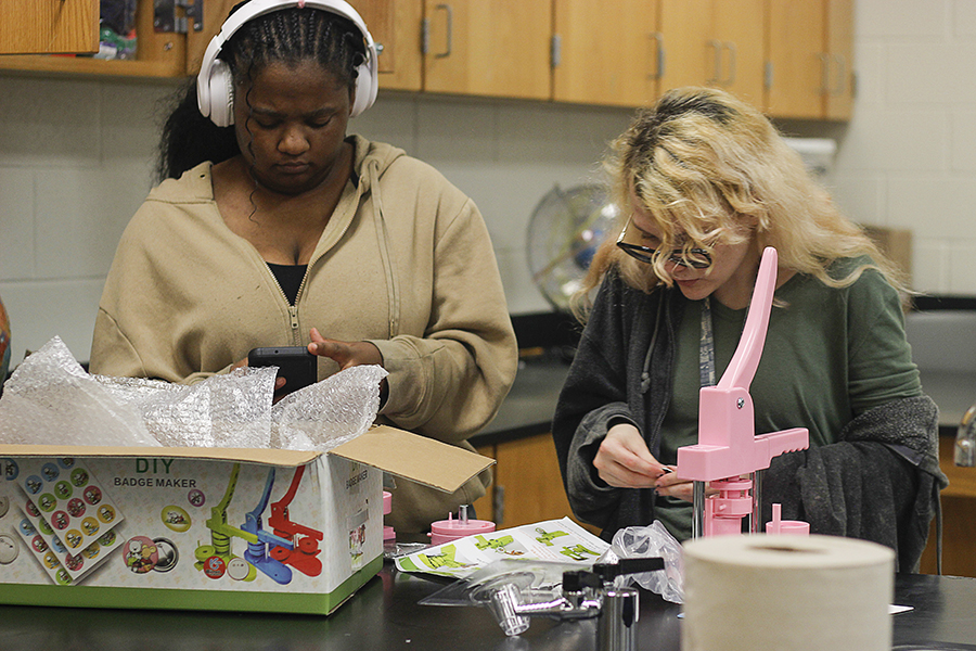 Threads of Kindness members collaborate at the pinsetter station.