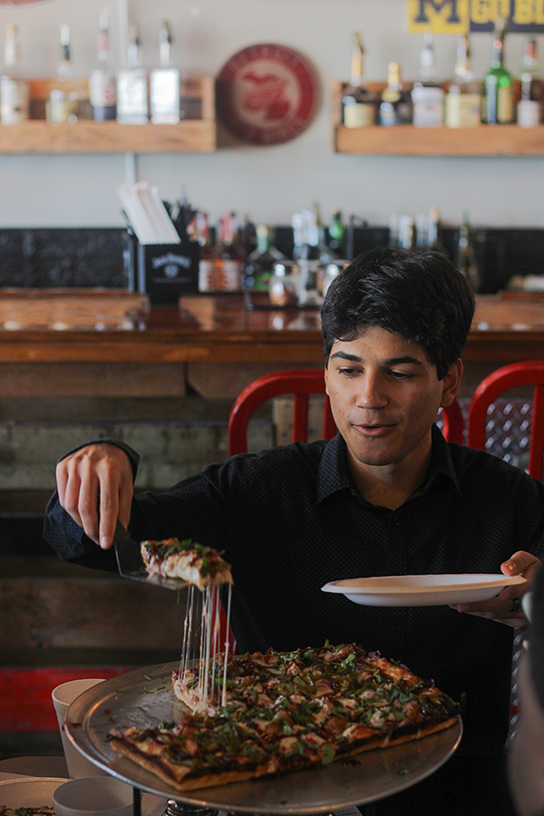 Senior Lisandro Suarez digs into a slice of "Sweet Jesus."